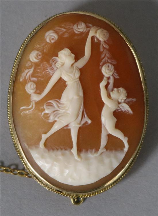 A 9ct gold carved cameo brooch carved with dancing nymphs, 40mm.